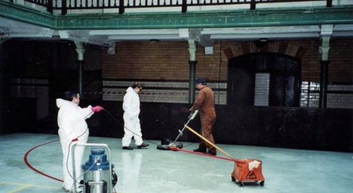Cleaners pictured in the Sports Hall cleaning the floor